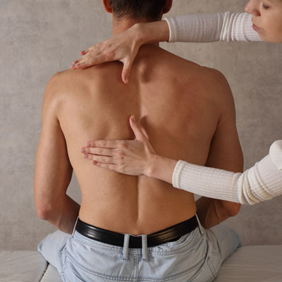 man receiving a chiropractic exam